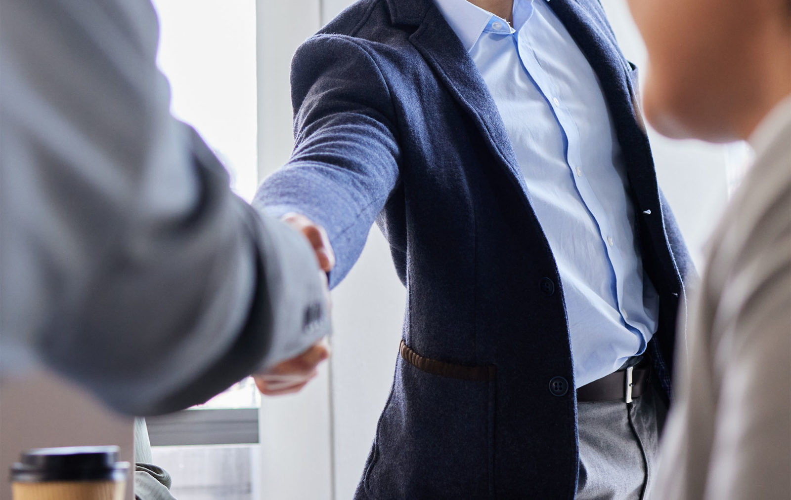 Two professionals shaking hands.