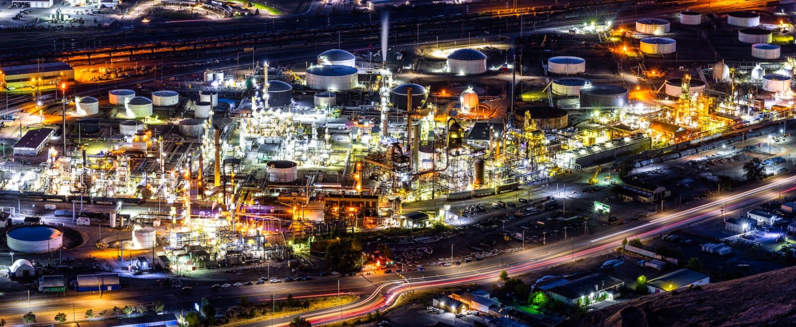 Illuminated oil refinery plant at night, in Salt Lake City, Utah